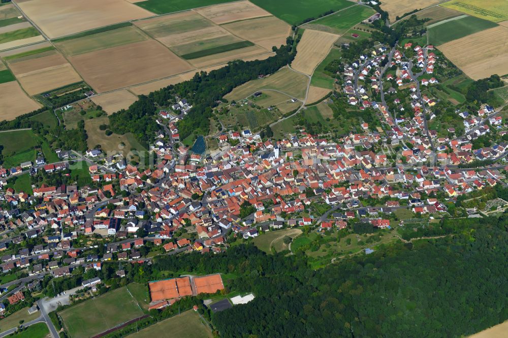 Theilheim from the bird's eye view: Village view on the edge of agricultural fields and land in Theilheim in the state Bavaria, Germany