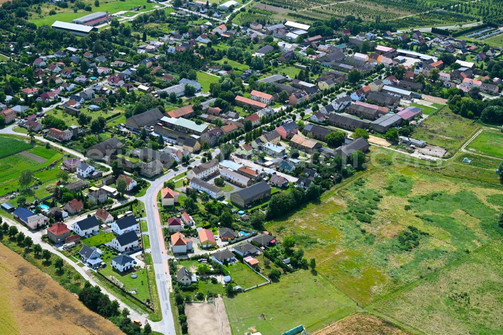 Aerial image Tremmen - Village view on the edge of agricultural fields and land in Tremmen in the state Brandenburg, Germany
