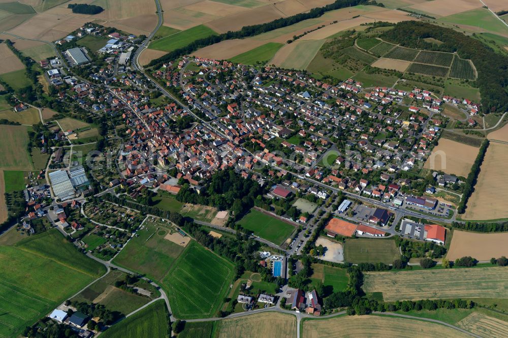 Uettingen from the bird's eye view: Village view on the edge of agricultural fields and land in Uettingen in the state Bavaria, Germany