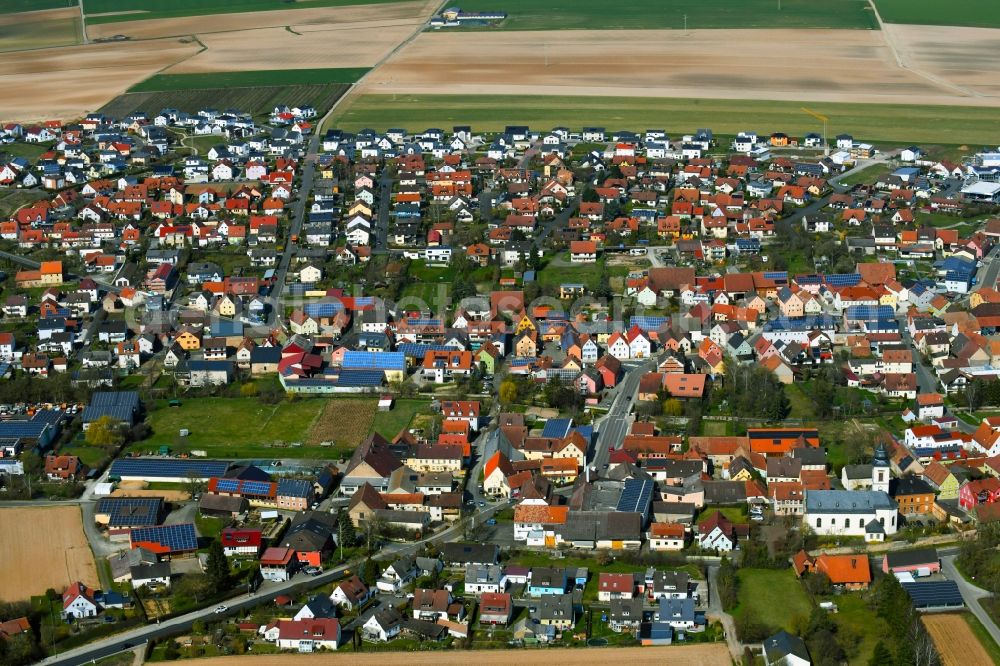 Unterpleichfeld from the bird's eye view: Town view with streets, houses and residential areas on the edge of agricultural fields and usable areas in Unterpleichfeld in the state Bavaria, Germany