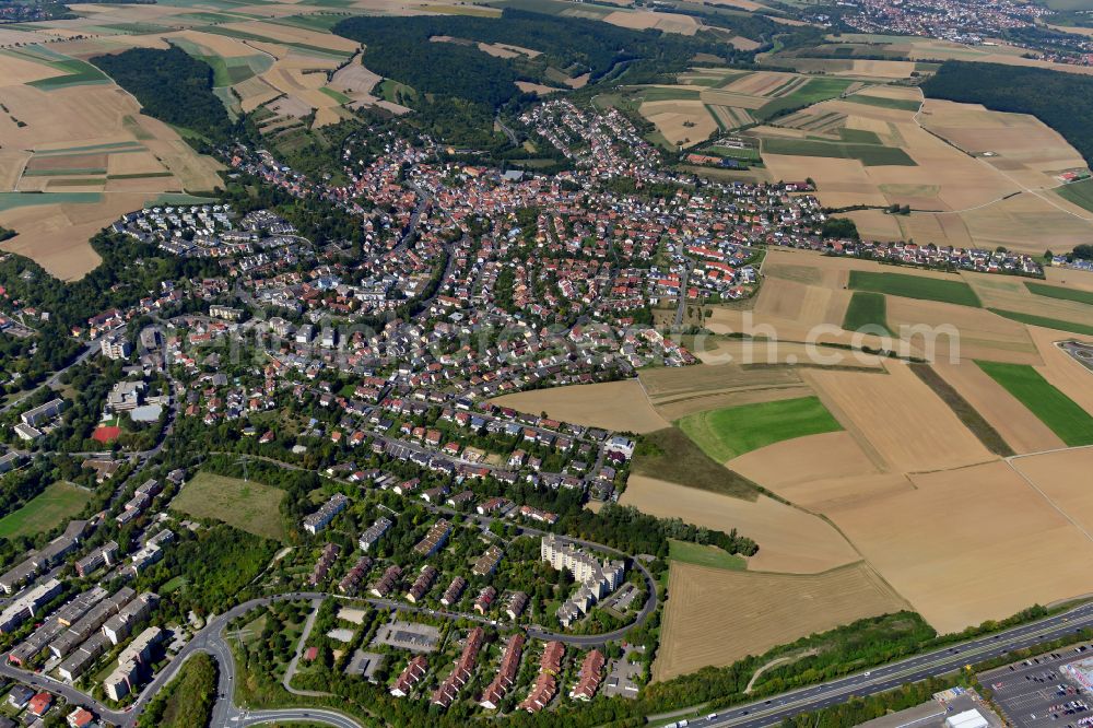 Versbach from the bird's eye view: Village view on the edge of agricultural fields and land in Versbach in the state Bavaria, Germany