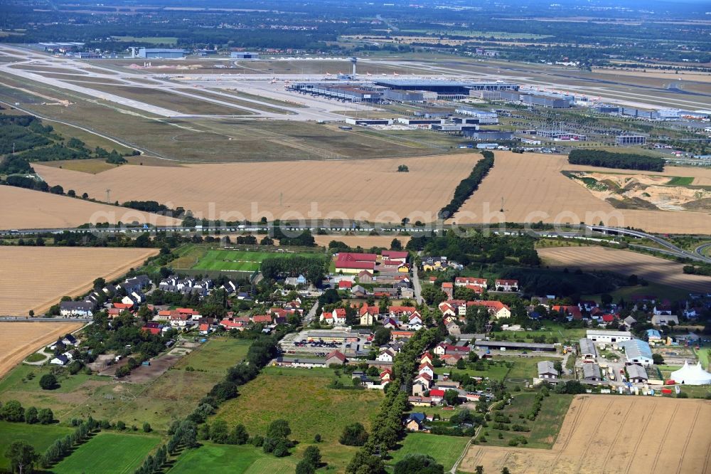 Waltersdorf from the bird's eye view: Village view on the edge of agricultural fields and land in Waltersdorf in the state Brandenburg, Germany
