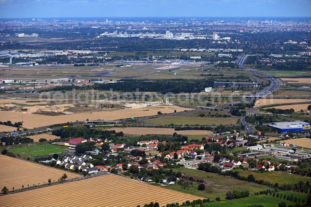 Aerial image Waltersdorf - Village view on the edge of agricultural fields and land in Waltersdorf in the state Brandenburg, Germany