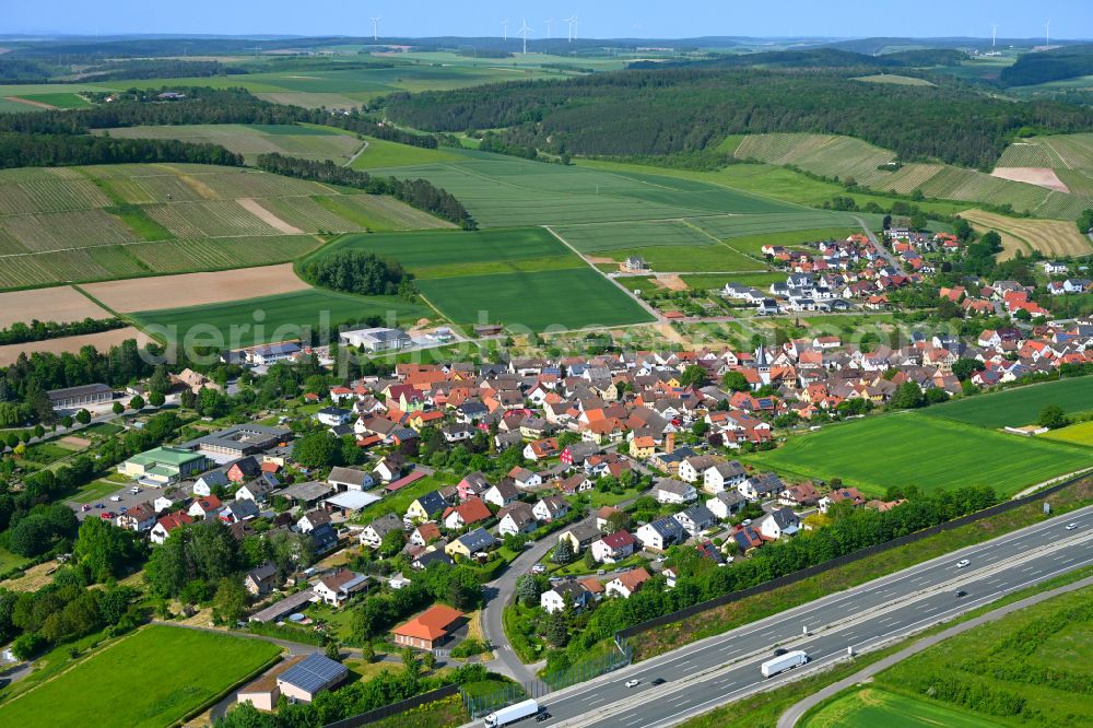Wertheim from the bird's eye view: Village view on the edge of agricultural fields and land in Wertheim in the state Baden-Wuerttemberg, Germany
