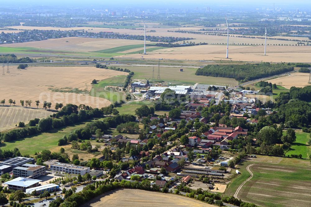 Panketal from above - Agricultural land and field boundaries surround the settlement area of the village in the district Schwanebeck in Panketal in the state Brandenburg, Germany