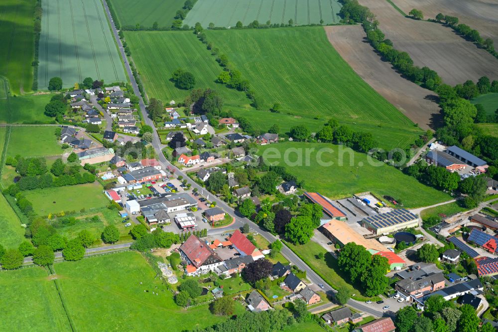 Stuvenborn from the bird's eye view: Town View of the streets and houses of the residential areas along the main street in Stuvenborn in the state Schleswig-Holstein, Germany