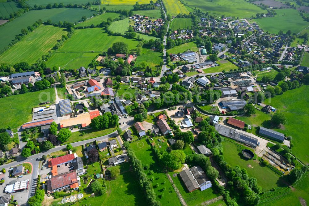 Aerial photograph Stuvenborn - Town View of the streets and houses of the residential areas along the main street in Stuvenborn in the state Schleswig-Holstein, Germany
