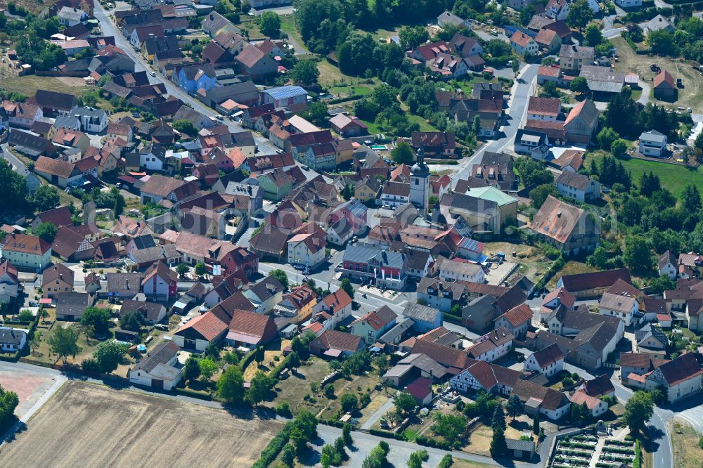 Aerial image Sulzfeld - Town View of the streets and houses of the residential areas on street Wagenweg in Sulzfeld in the state Bavaria, Germany
