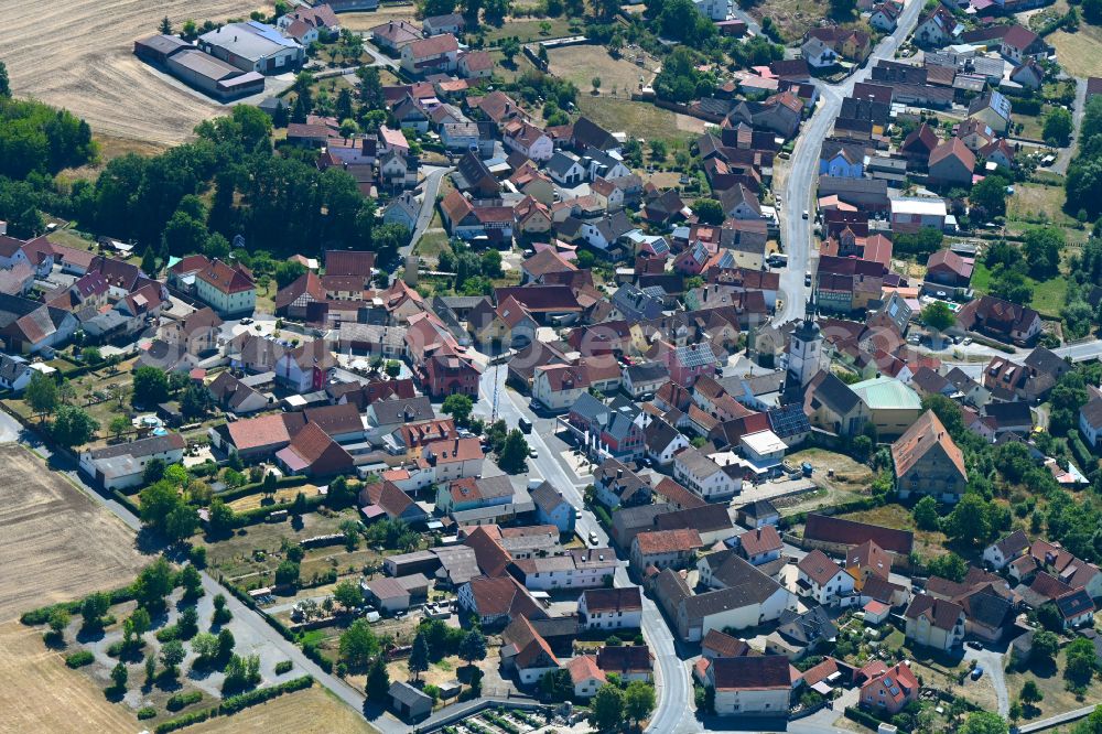 Sulzfeld from above - Town View of the streets and houses of the residential areas on street Wagenweg in Sulzfeld in the state Bavaria, Germany