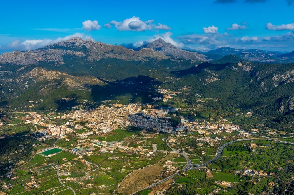 Andratx from the bird's eye view: Location view of the streets and houses of residential areas in the valley landscape surrounded by mountains in Andratx in Balearische Insel Mallorca, Spain