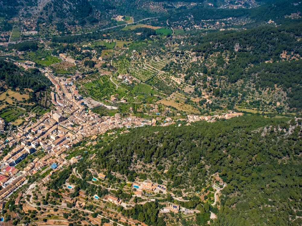 Aerial image Bunyola - Location view of the streets and houses of residential areas in the valley landscape surrounded by mountains in Bunyola in Balearic island of Mallorca, Spain