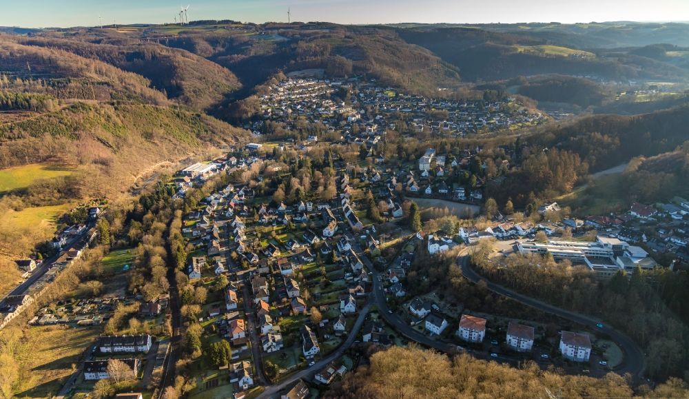 Dahl from the bird's eye view: Location view of the streets and houses of residential areas in the valley landscape surrounded by mountains in Dahl in the state North Rhine-Westphalia, Germany