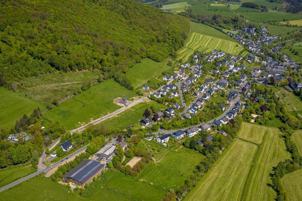 Grafschaft from above - Location view of the streets and houses of residential areas in the valley landscape surrounded by mountains on street Schulstrasse in Grafschaft at Sauerland in the state North Rhine-Westphalia, Germany