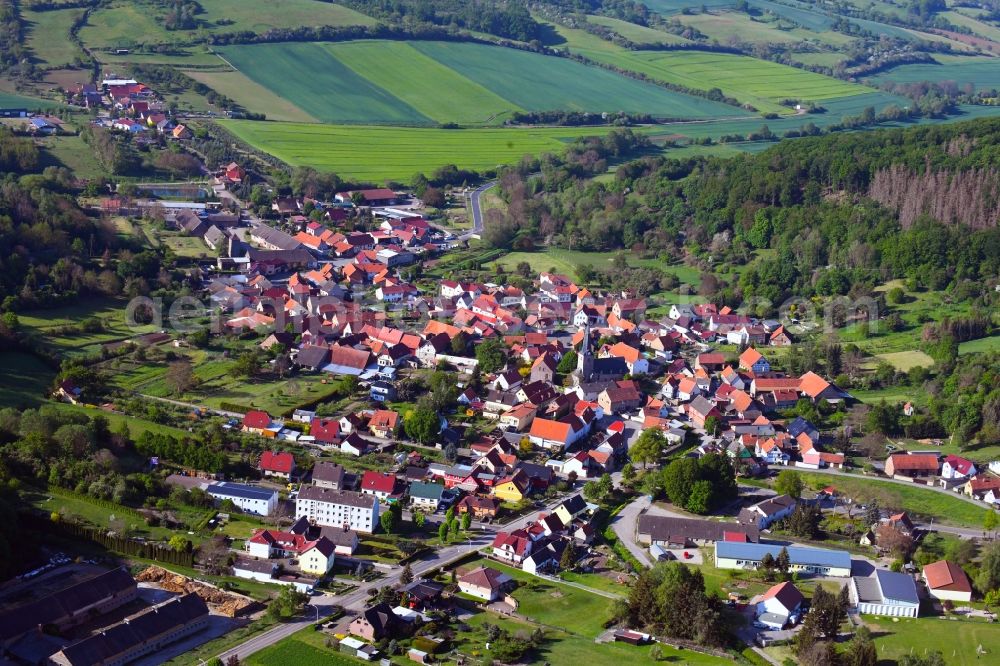 Aerial image Großleinungen - Location view of the streets and houses of residential areas in the valley landscape surrounded by mountains in Grossleinungen in the state Saxony-Anhalt, Germany