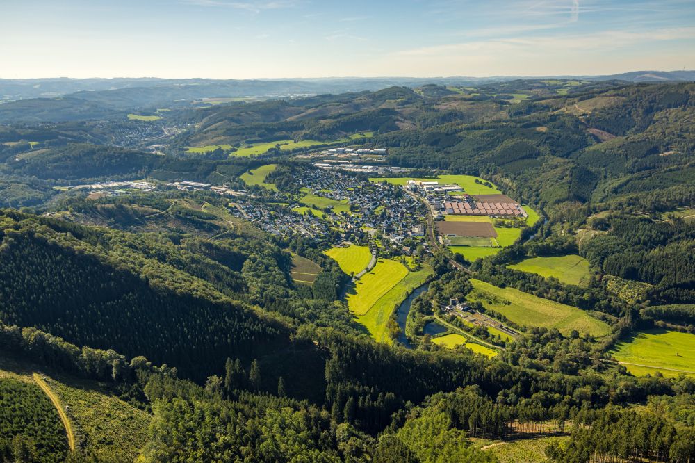 Lenhausen from the bird's eye view: Location view of the streets and houses of residential areas in the valley landscape surrounded by mountains in Lenhausen in the state North Rhine-Westphalia, Germany