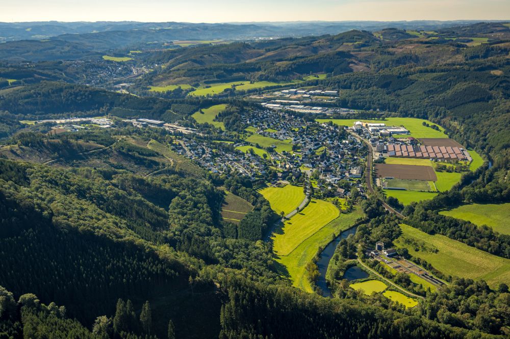 Aerial image Lenhausen - Location view of the streets and houses of residential areas in the valley landscape surrounded by mountains in Lenhausen in the state North Rhine-Westphalia, Germany