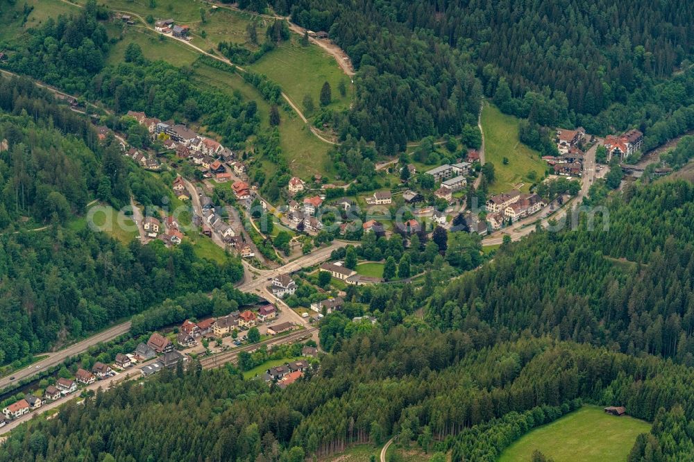 Schönmünzach from above - Location view of the streets and houses of residential areas in the valley landscape surrounded by mountains in Schoenmuenzach in the state Baden-Wuerttemberg, Germany