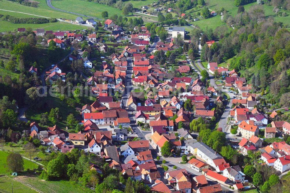 Nazza from the bird's eye view: Location view of the streets and houses of residential areas in the valley landscape surrounded by mountains in Nazza in the state Thuringia, Germany