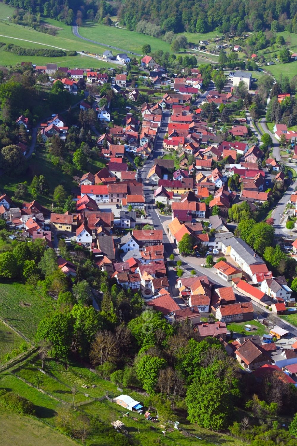 Aerial image Nazza - Location view of the streets and houses of residential areas in the valley landscape surrounded by mountains in Nazza in the state Thuringia, Germany