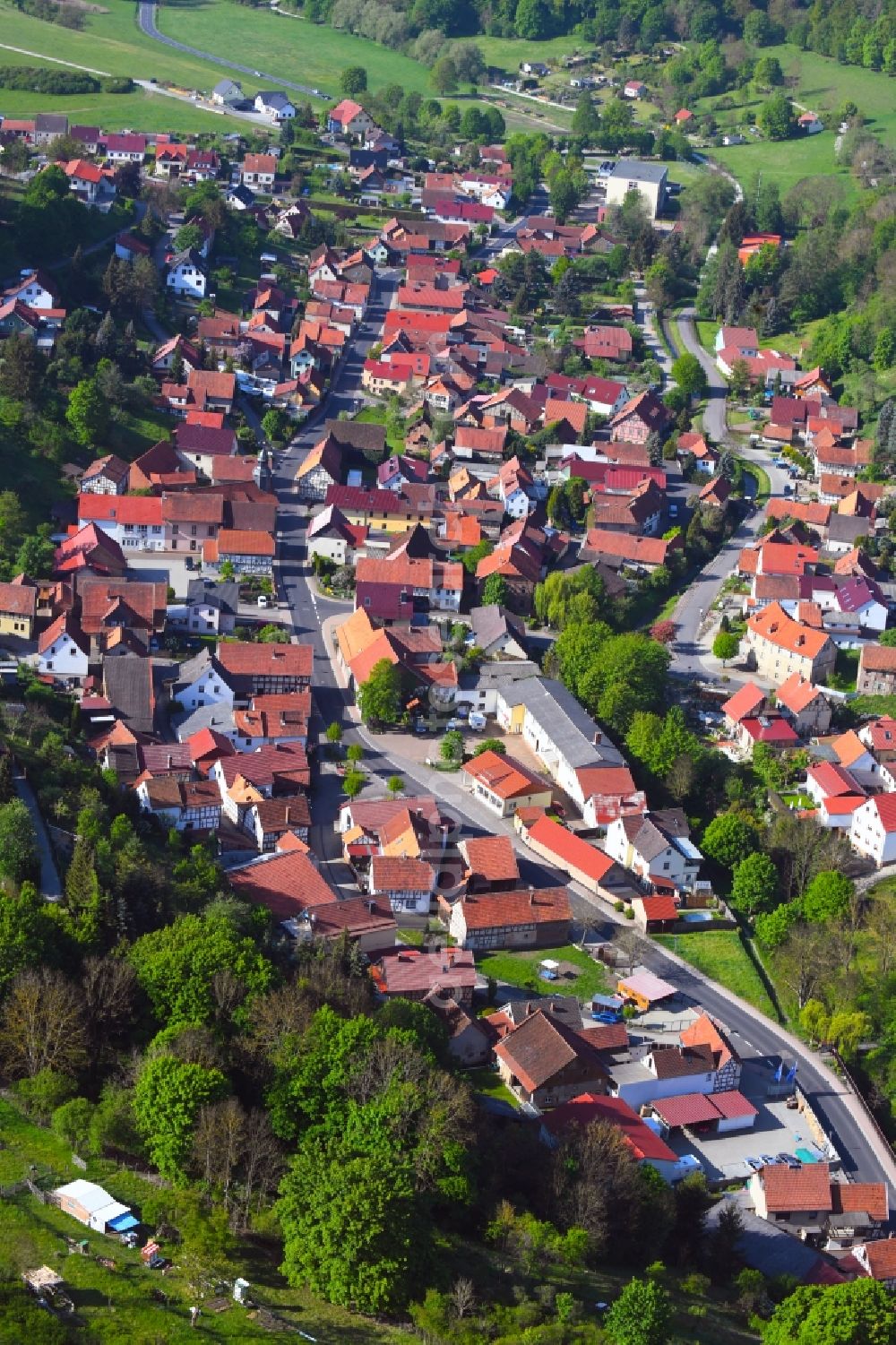 Aerial photograph Nazza - Location view of the streets and houses of residential areas in the valley landscape surrounded by mountains in Nazza in the state Thuringia, Germany