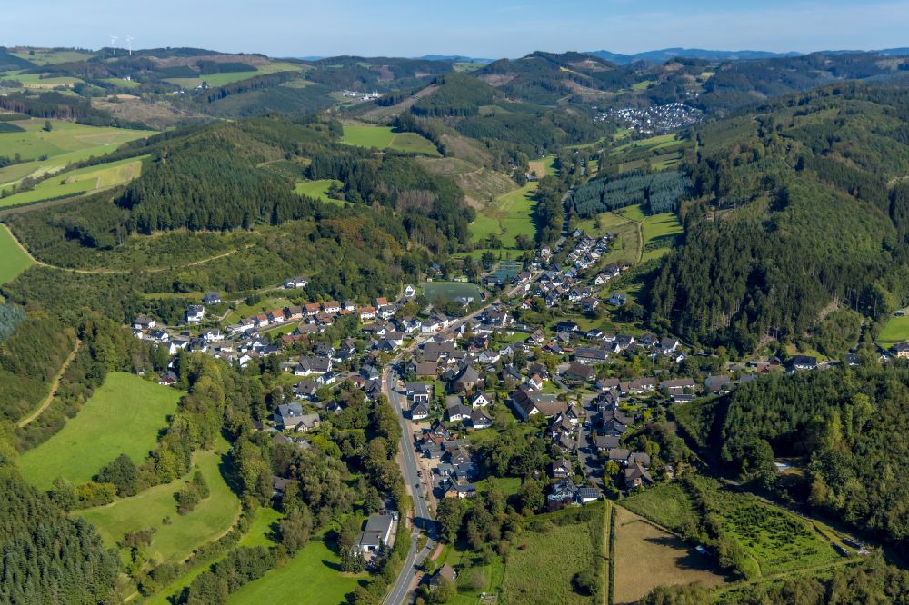 Oberelspe from the bird's eye view: Location view of the streets and houses of residential areas in the valley landscape surrounded by mountains in Oberelspe in the state North Rhine-Westphalia, Germany