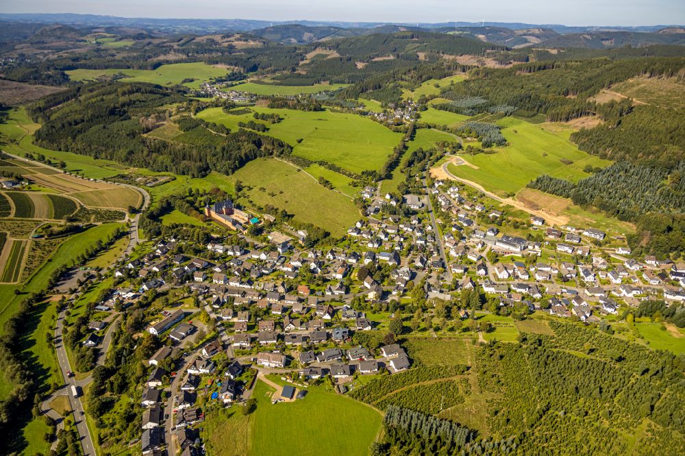 Aerial image Oberhundem - Location view of the streets and houses of residential areas in the valley landscape surrounded by mountains in Oberhundem at Sauerland in the state North Rhine-Westphalia, Germany