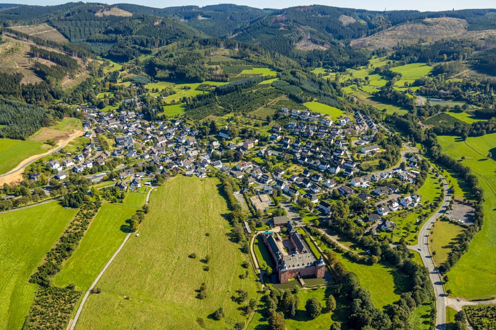 Oberhundem from above - Location view of the streets and houses of residential areas in the valley landscape surrounded by mountains in Oberhundem at Sauerland in the state North Rhine-Westphalia, Germany