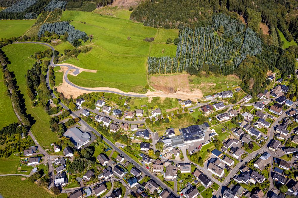 Aerial image Oberhundem - Location view of the streets and houses of residential areas in the valley landscape surrounded by mountains in Oberhundem at Sauerland in the state North Rhine-Westphalia, Germany
