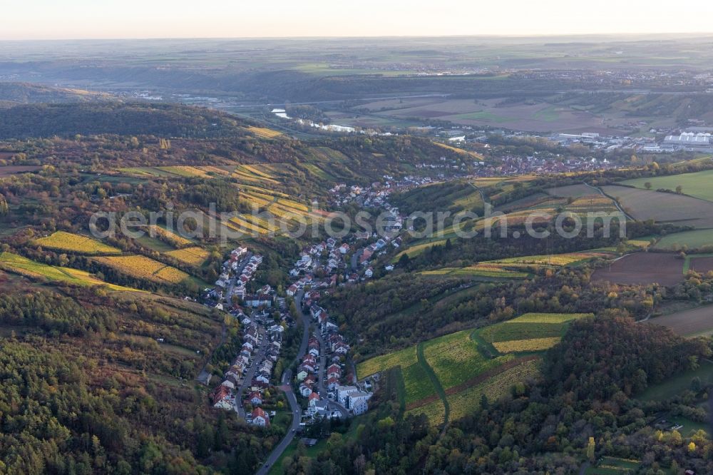 Randersacker from above - Location view of the streets and houses of residential areas in the valley landscape surrounded by vine yards in Randersacker in the state Bavaria, Germany