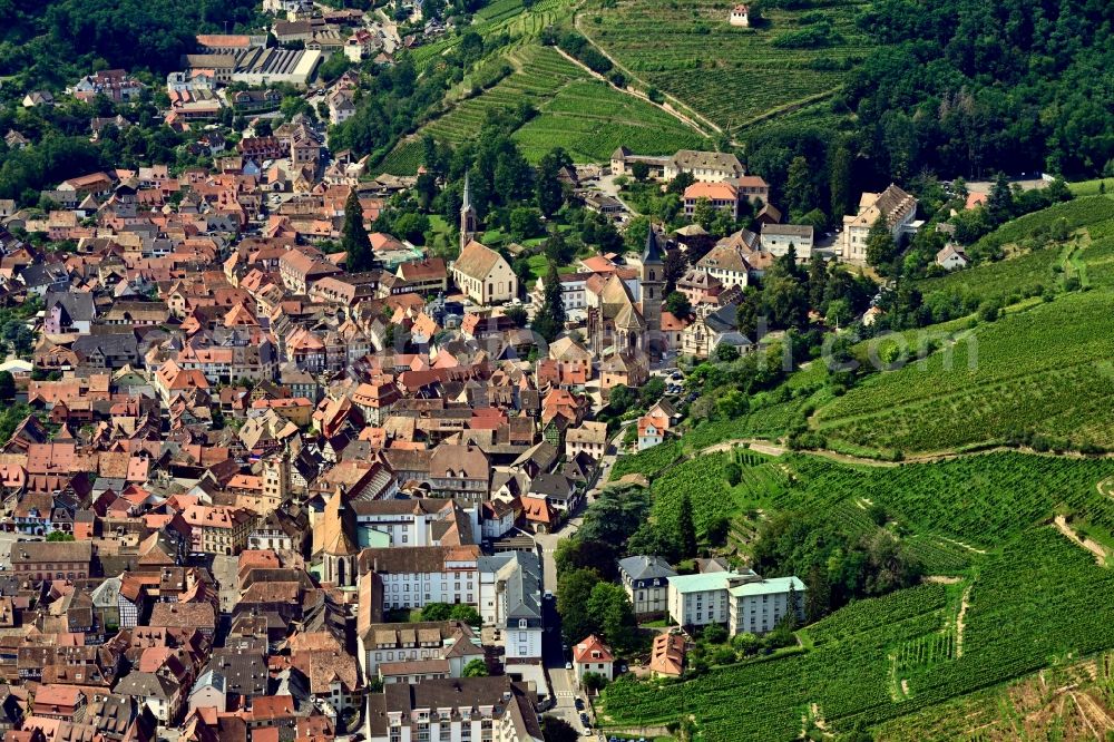 Ribeauville from the bird's eye view: Location view of the streets and houses of residential areas in the valley landscape surrounded by mountains in Ribeauville in Grand Est, France