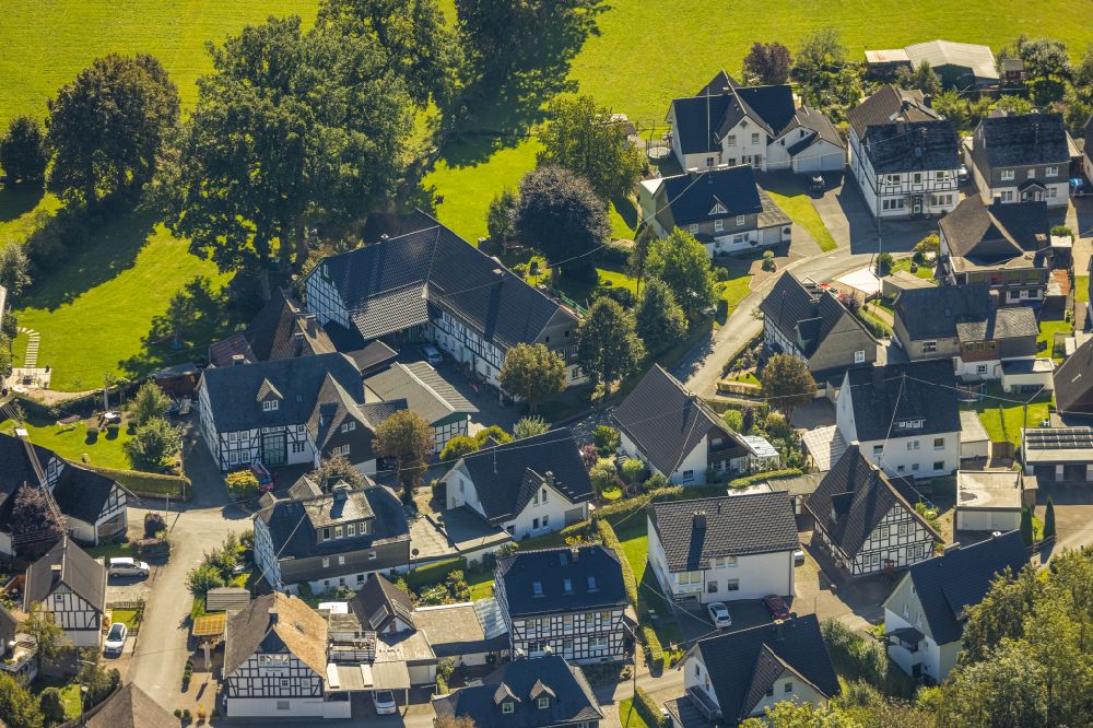 Aerial image Saalhausen - Location view of the streets and houses of residential areas in the valley landscape surrounded by mountains on street Auf der Stenn in Saalhausen in the state North Rhine-Westphalia, Germany