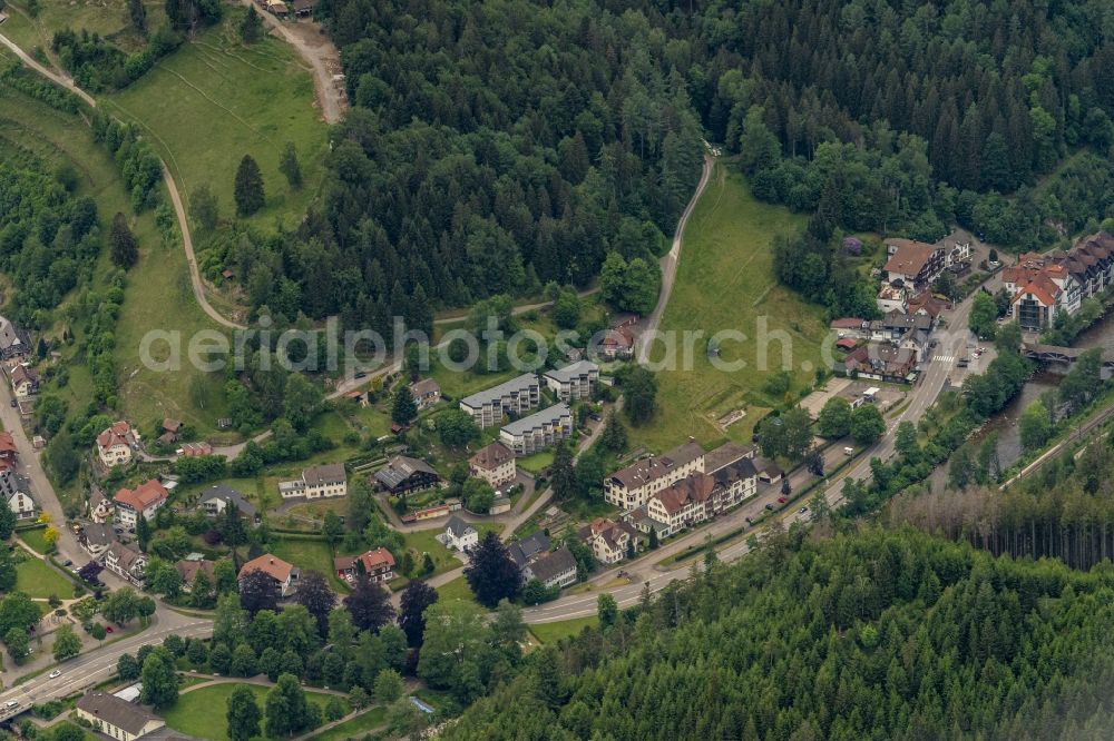 Schönmünzach from above - Location view of the streets and houses of residential areas in the valley landscape surrounded by mountains in Schoenmuenzach in the state Baden-Wuerttemberg, Germany