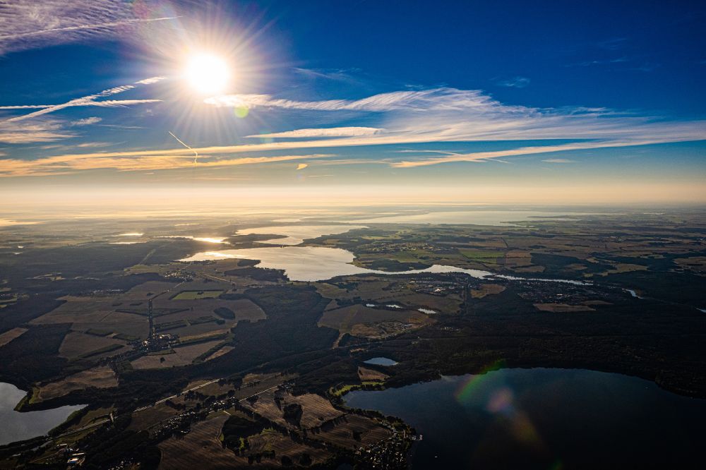 Aerial image Malchow - City view at sunrise on the shore area of Lake Malchower with a view of Fleesensee in Malchow in the state Mecklenburg - Western Pomerania, Germany