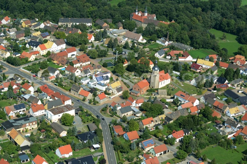 Aerial image Zschepplin - View of the borough of Zschepplin in the state of Saxony. The borough is located in the county district of North Saxony, surrounded by hills and fields and consists of residential buildings. The church St.Lucia is located in its centre and Castle Zschepplin on the edge of the borough