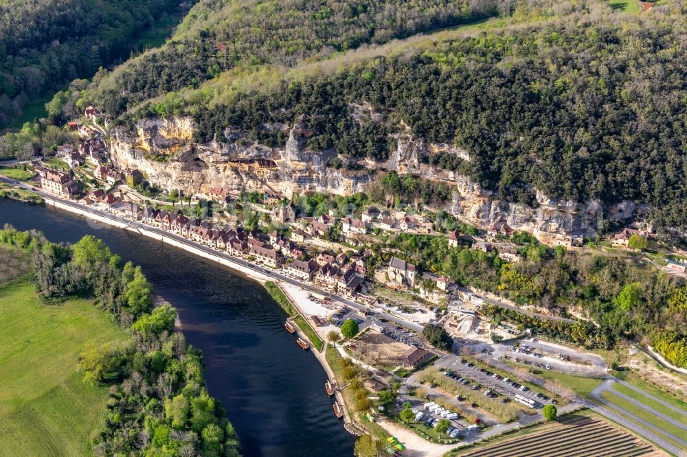 Aerial image La Roque-Gageac - Town on the banks of the river of Dordogne with Chateau de la Malartrie in La Roque-Gageac in Nouvelle-Aquitaine, France