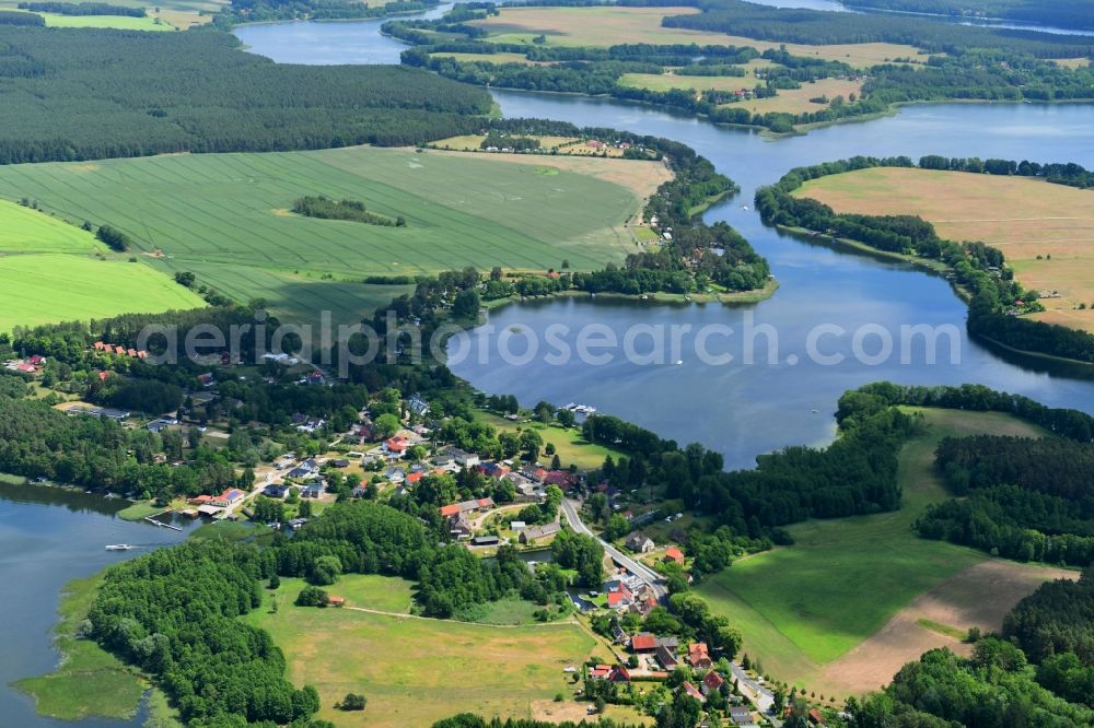Canow from the bird's eye view: Village on the banks of the area of Canower See in Canow in the state Mecklenburg - Western Pomerania, Germany