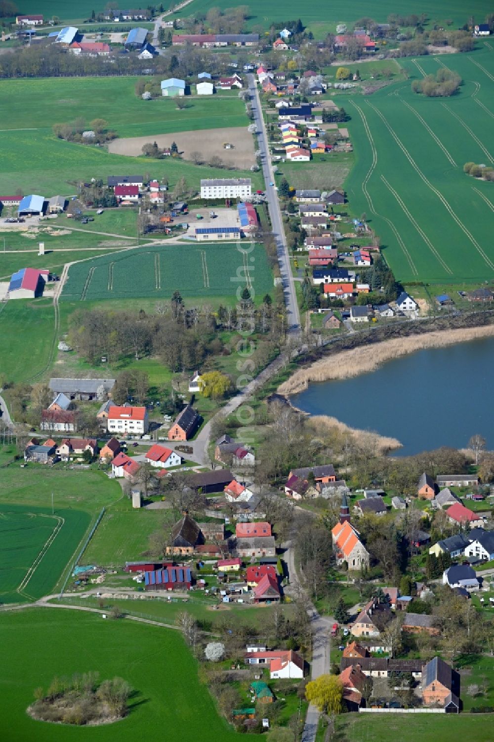 Wollin from above - Village on the banks of the area lake of Dorfsee in Wollin in the state Mecklenburg - Western Pomerania, Germany
