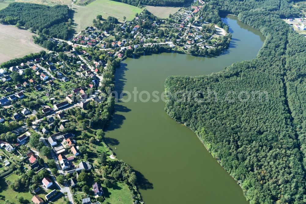Krummensee from the bird's eye view: Village on the banks of the area Krummer See in Krummensee in the state Brandenburg