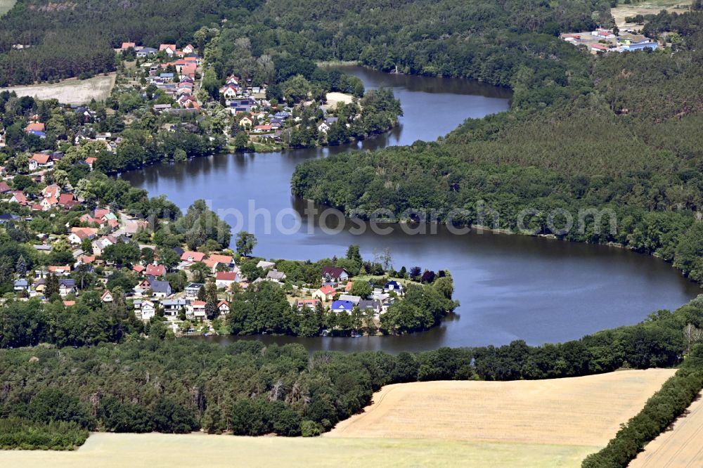 Krummensee from the bird's eye view: Village on the banks of the area Krummer See in Krummensee in the state Brandenburg