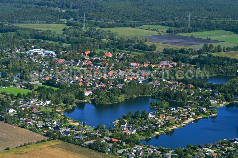 Güster from above - Village on the banks of the area lake of Pruesssee in Guester in the state Schleswig-Holstein, Germany