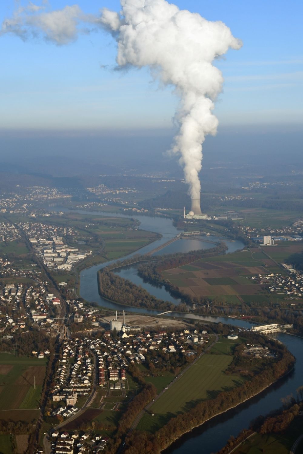 Albbruck from the bird's eye view: Village on the banks of the Rhine - river in Albbruck in the state Baden-Wurttemberg, Germany. Steam column of the nuclear power station KKL Leibstadt in Switzerland