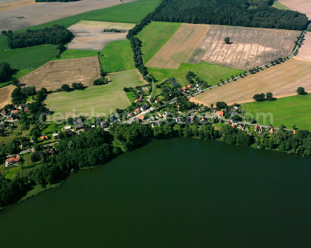 Aerial image Seedorf - Village on the banks of the area lake on Seedorfer Kuechensee along the Dorfstrasse in Seedorf in the state Schleswig-Holstein, Germany