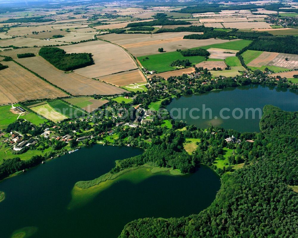 Seedorf from the bird's eye view: Village on the banks of the area lake on Seedorfer Kuechensee in Seedorf in the state Schleswig-Holstein, Germany