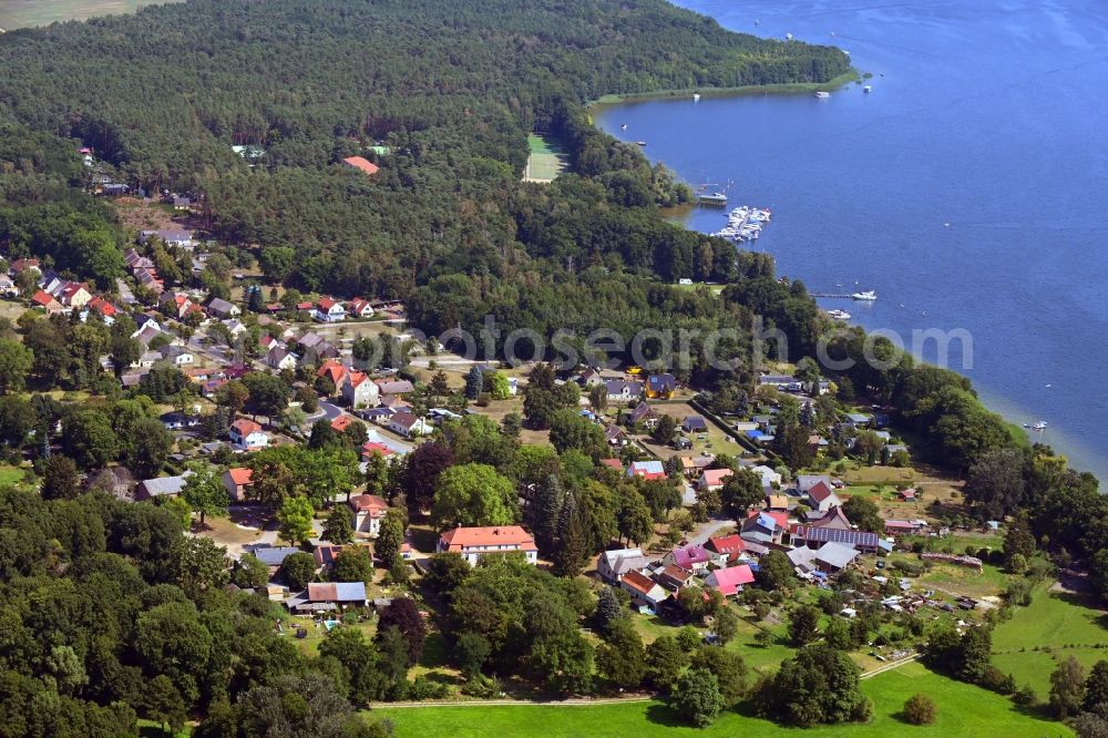 Blossin from the bird's eye view: Village on the banks of the area lake Wolziger See in Blossin in the state Brandenburg, Germany