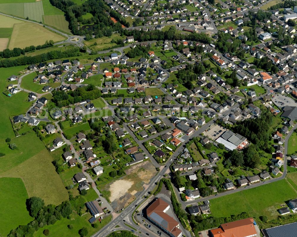 Aerial photograph Asbach - View of the South of Asbach in the state of Rhineland-Palatinate. The borough and municipiality Asbach is located in the county district of Neuwied in the Westerwald forest region and surrounded by fields, meadows and hills. The borough sits between the nature parks of Rhine-Westerwald and Bergisches Land. Along the county road L255 in the South of the village, there is a residential area and several stores and shops