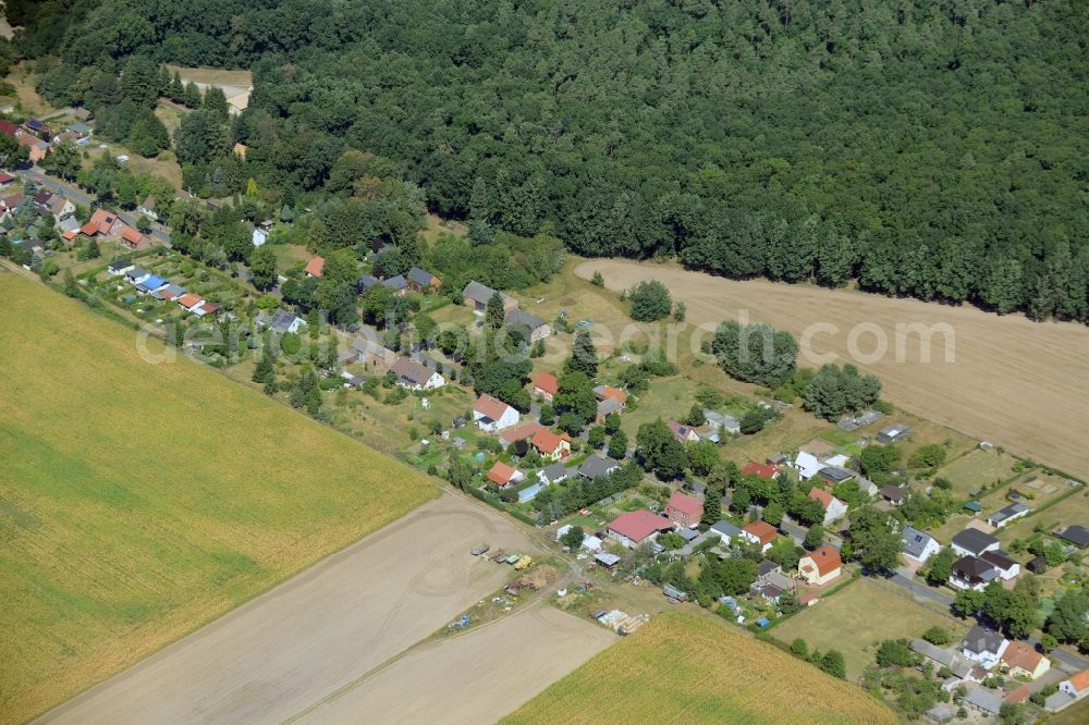 Rietz-Neuendorf from the bird's eye view: View of the village of Neubrueck in the East of the borough of Rietz-Neuendorf in the state of Brandenburg. The residential village is surrounded by fields and forest along Spreestrasse