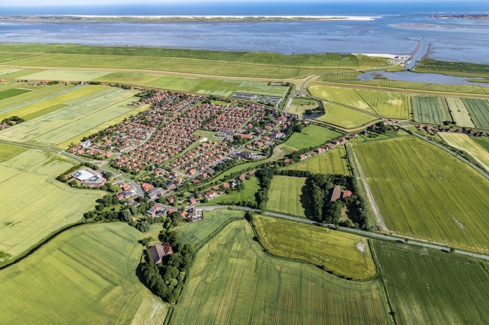 Aerial image Dornum - East Frisian coast near Nessmersiehl in the state of Lower Saxony. The community Dorum is located in Ostfriesland on the North Sea coast. Along the coastline extends the Lower Saxony Wadden Sea National Park, which has been a UNESCO World Heritage Site since 2009. The landscape is characterized by the Wadden Sea, agriculture and fields