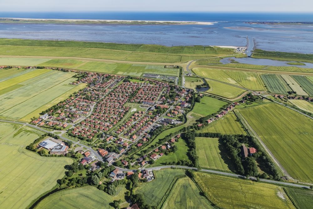 Dornum from above - East Frisian coast near Nessmersiehl in the state of Lower Saxony. The community Dorum is located in Ostfriesland on the North Sea coast. Along the coastline extends the Lower Saxony Wadden Sea National Park, which has been a UNESCO World Heritage Site since 2009. The landscape is characterized by the Wadden Sea, agriculture and fields