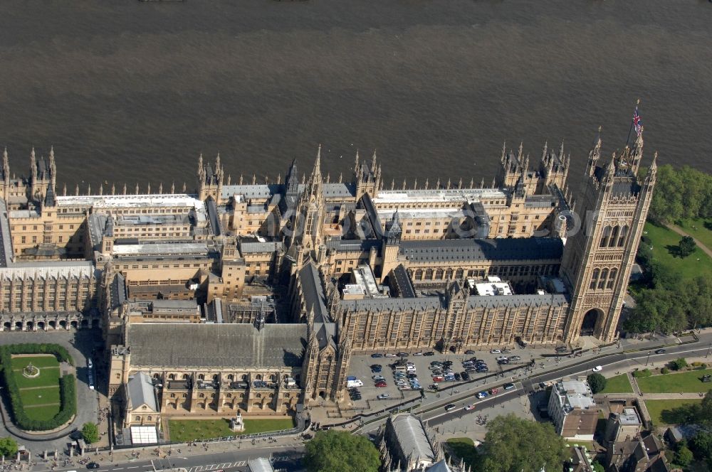 Aerial image London - View of the Palace of Westminster / Westminster Palace in London. monumental, neo-Gothic style building in London where the meeting consists of the House of Commons and the House of Lords, British Parliament. This is under the UNESCO World Heritage landmark located in the City of Westminster on Parliament Square, close to government buildings at Whitehall. The most famous part of the palace is the Clock Tower (Clock Tower), with the bell Big Ben