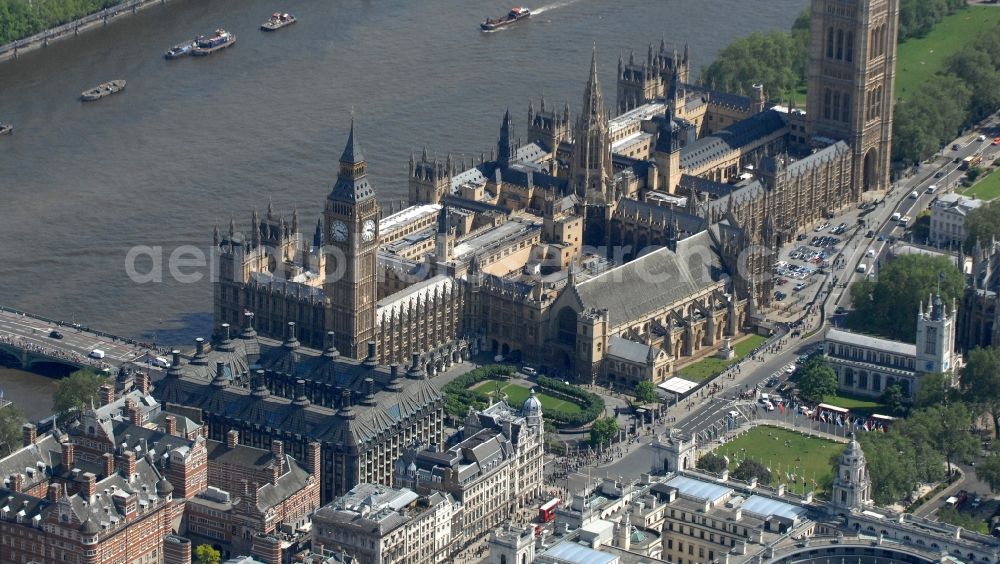 Aerial photograph London - View of the Palace of Westminster / Westminster Palace in London. monumental, neo-Gothic style building in London where the meeting consists of the House of Commons and the House of Lords, British Parliament. This is under the UNESCO World Heritage landmark located in the City of Westminster on Parliament Square, close to government buildings at Whitehall. The most famous part of the palace is the Clock Tower (Clock Tower), with the bell Big Ben